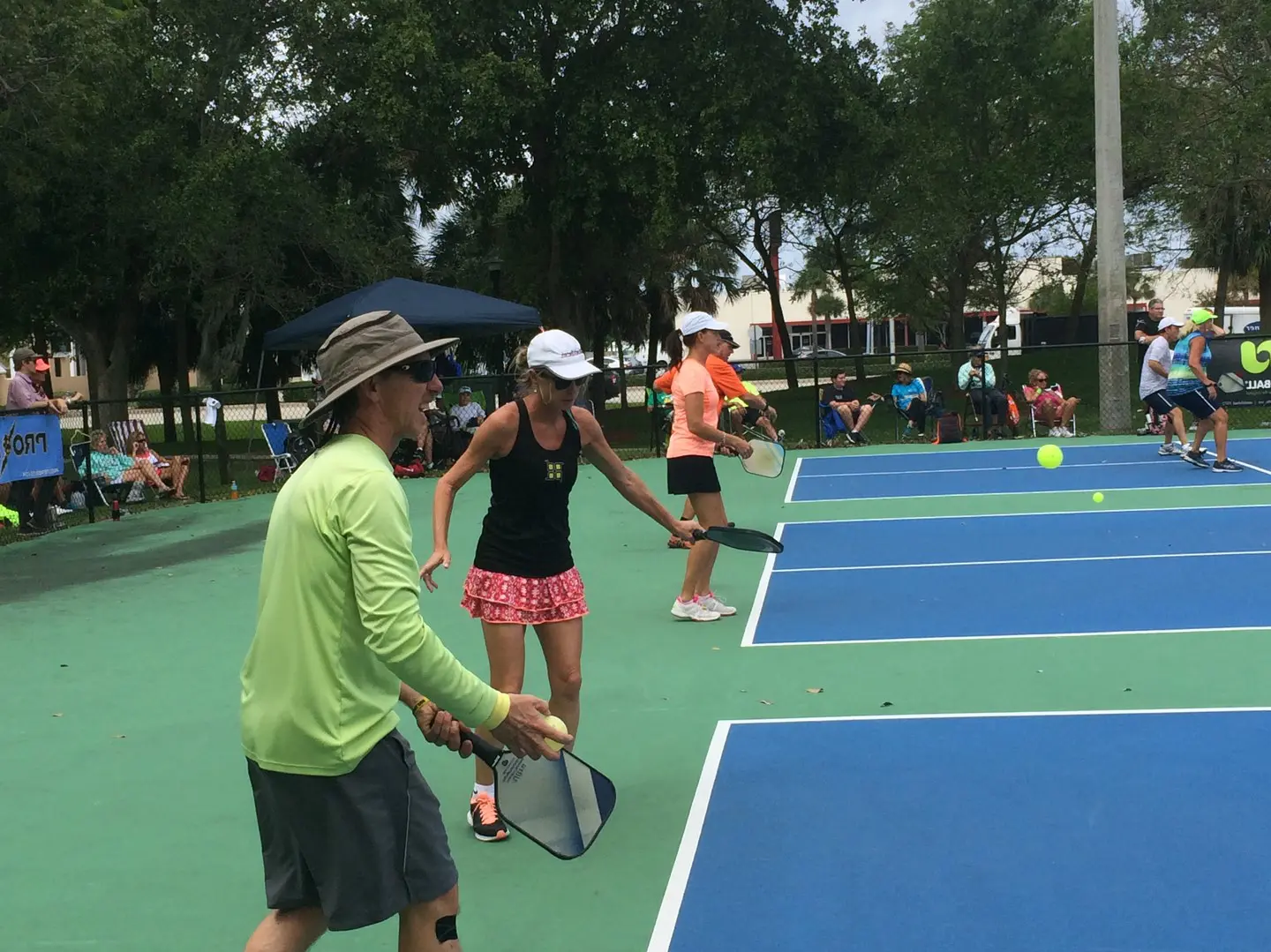 instructor helping a player with pickleball