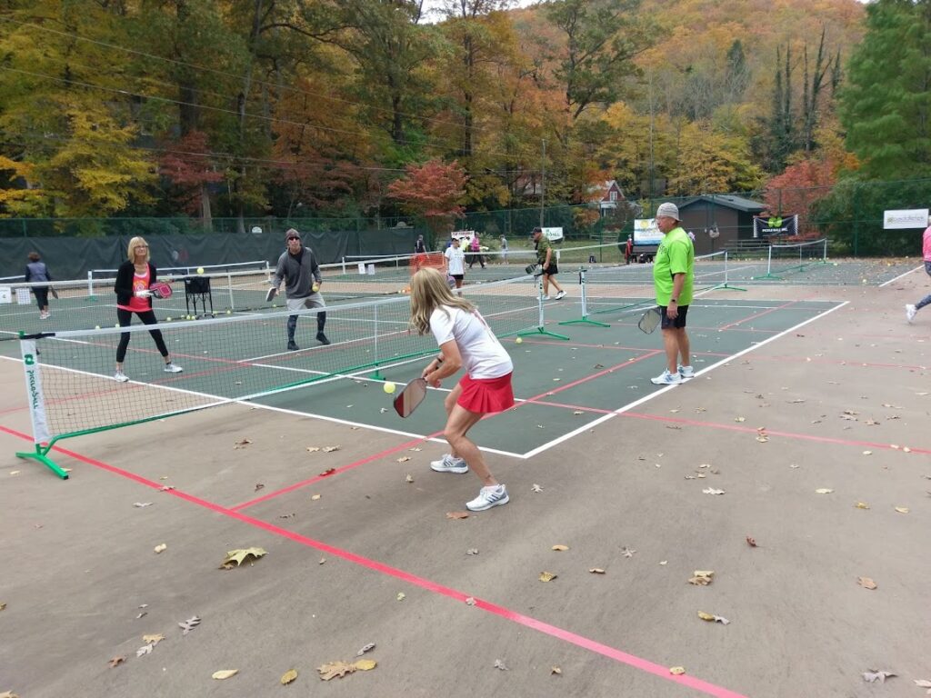 campers playing with pro john sperling at suncoast pickleball boot camp in montreat north carolina