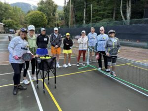 sylvia whitehouse instructing group at suncoast piclkeball camp in montreat north carolina by norman weathersby